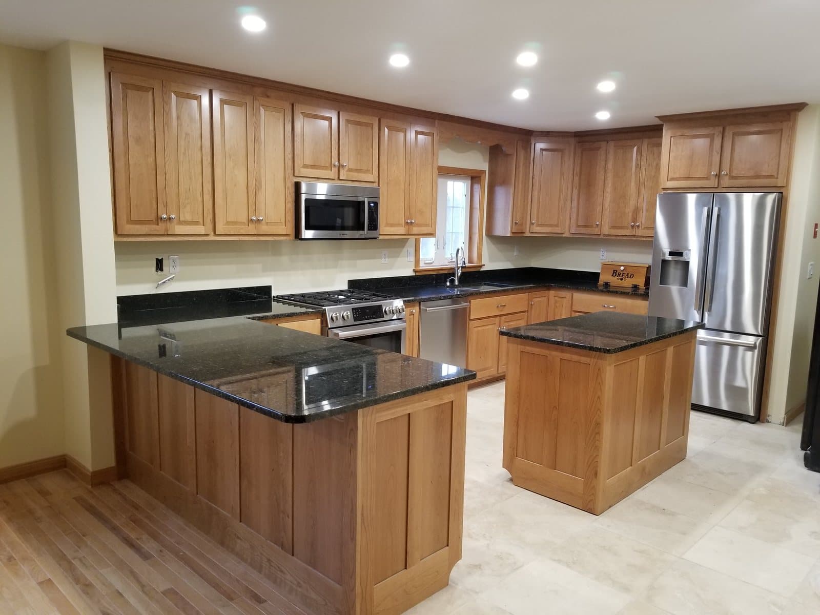 Birch kitchen with a granite island and full-height pantry