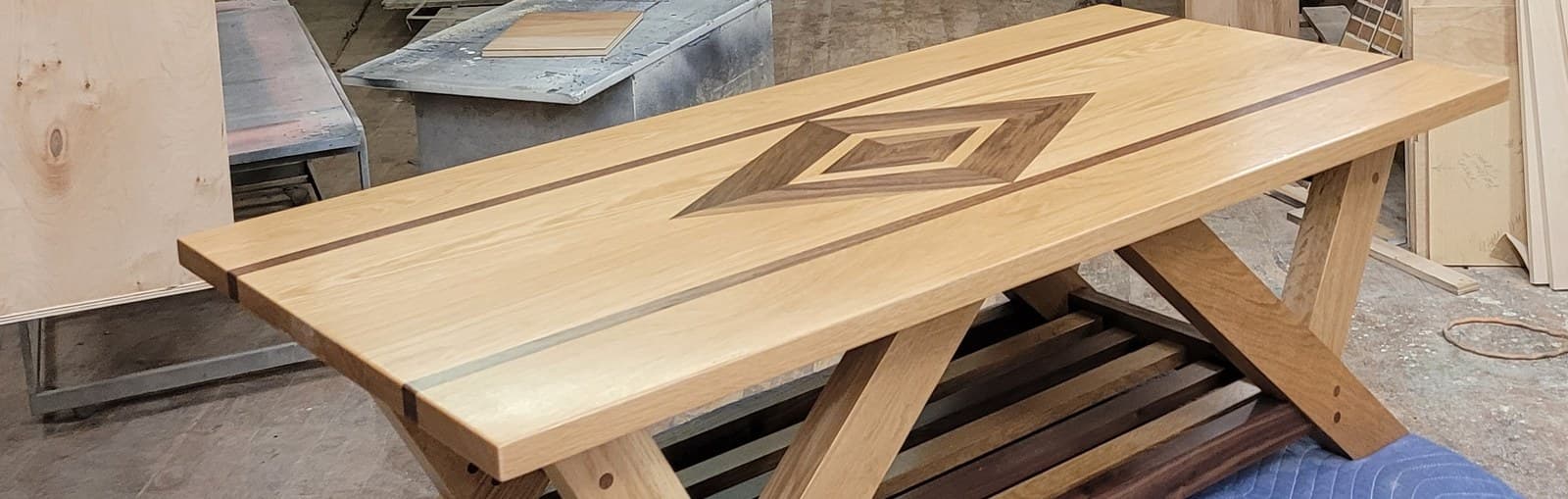 Diamond-inlay table top on its trestle base